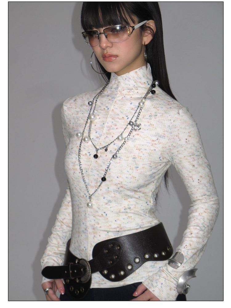 NEXT PASSPORT ivory fitted mock-neck long-sleeve tee styled with flared trousers.