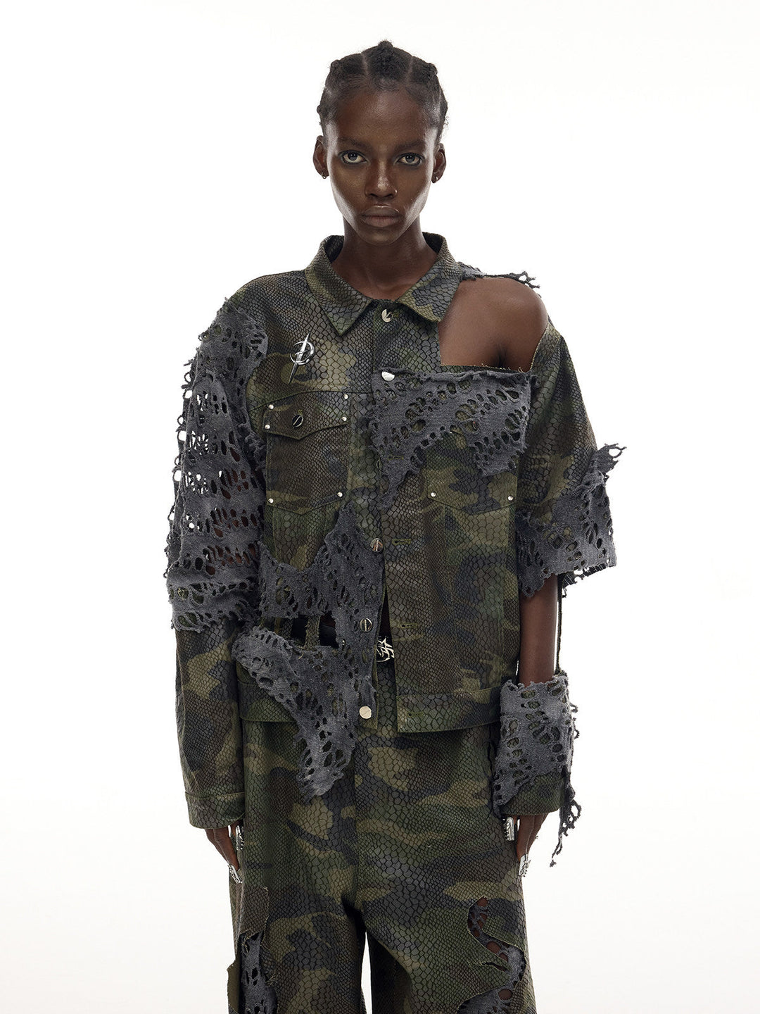 PINKSPINK ELECTRIC MOON distressed camouflage denim jacket — front modeled view showing the exposed shoulder and torn panels