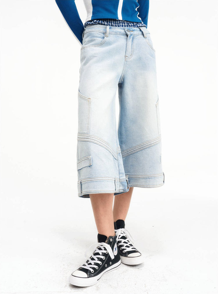 Close three-quarter view of the cropped wide-leg denim construction