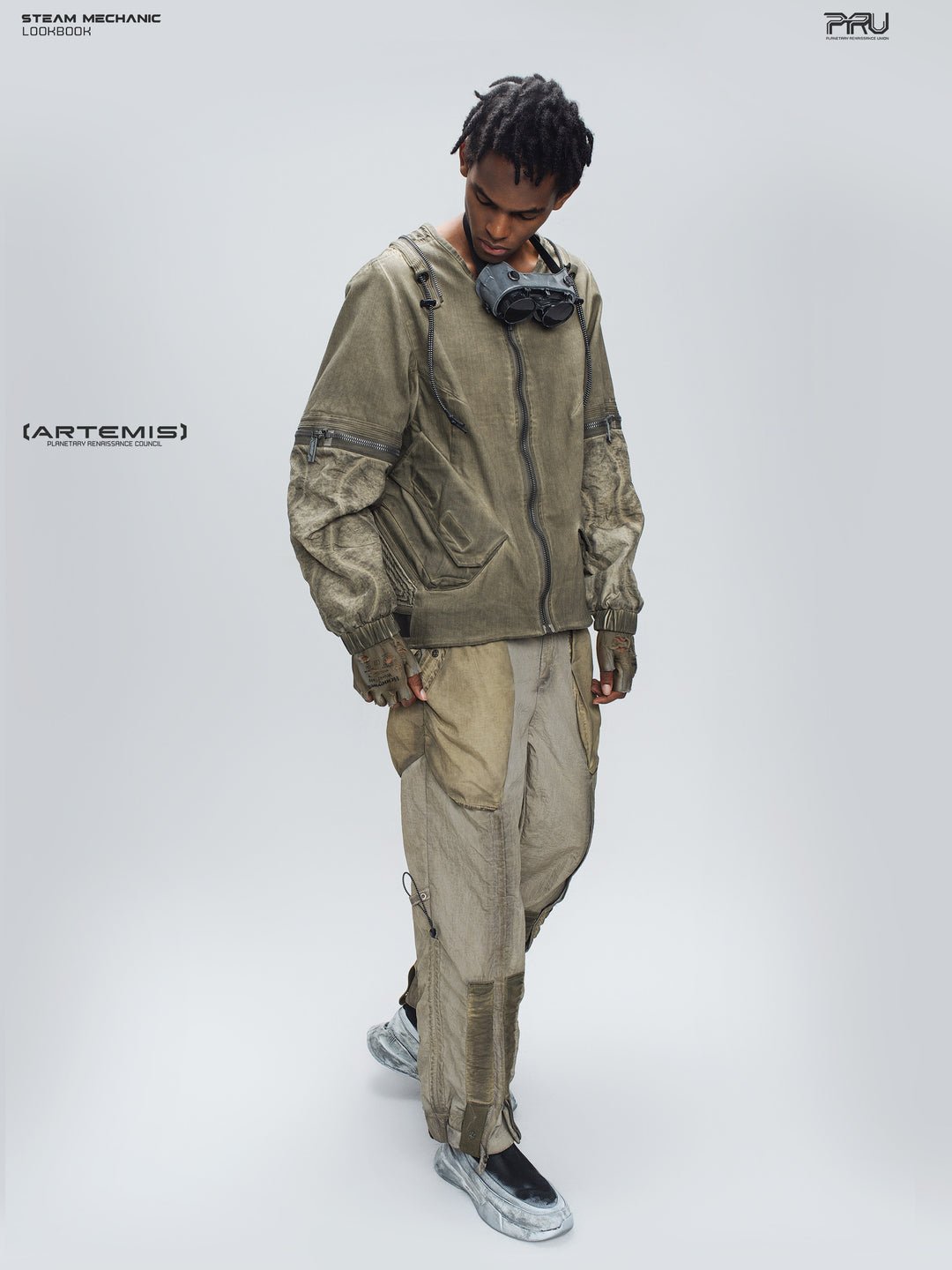PIONEER mercury-brown detachable-sleeve jacket, full-length crossed-leg pose showing weathered fabric