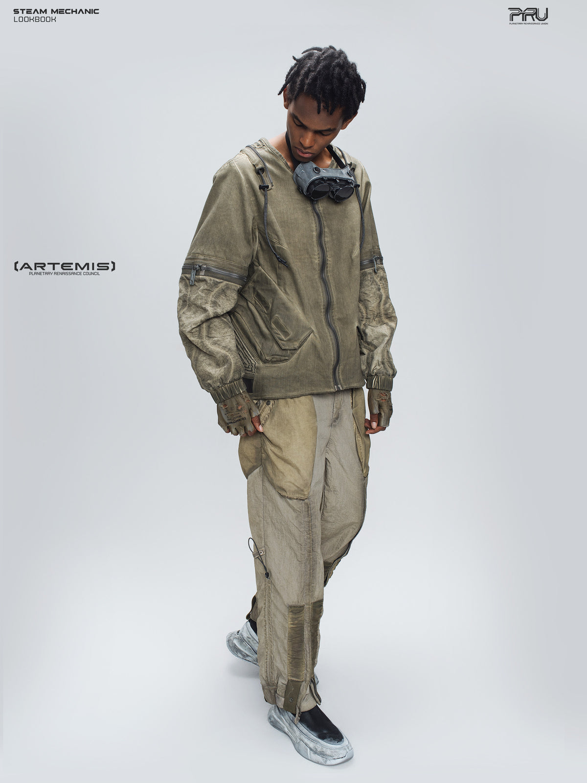 STEAM FUNCTION PIONEER mercury-brown detachable-sleeve jacket, full-length crossed-leg pose showing weathered fabric