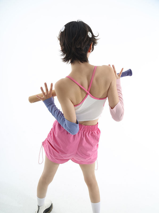 NEXT PASSPORT side-ruched drawstring mini shorts in pink, studio back view