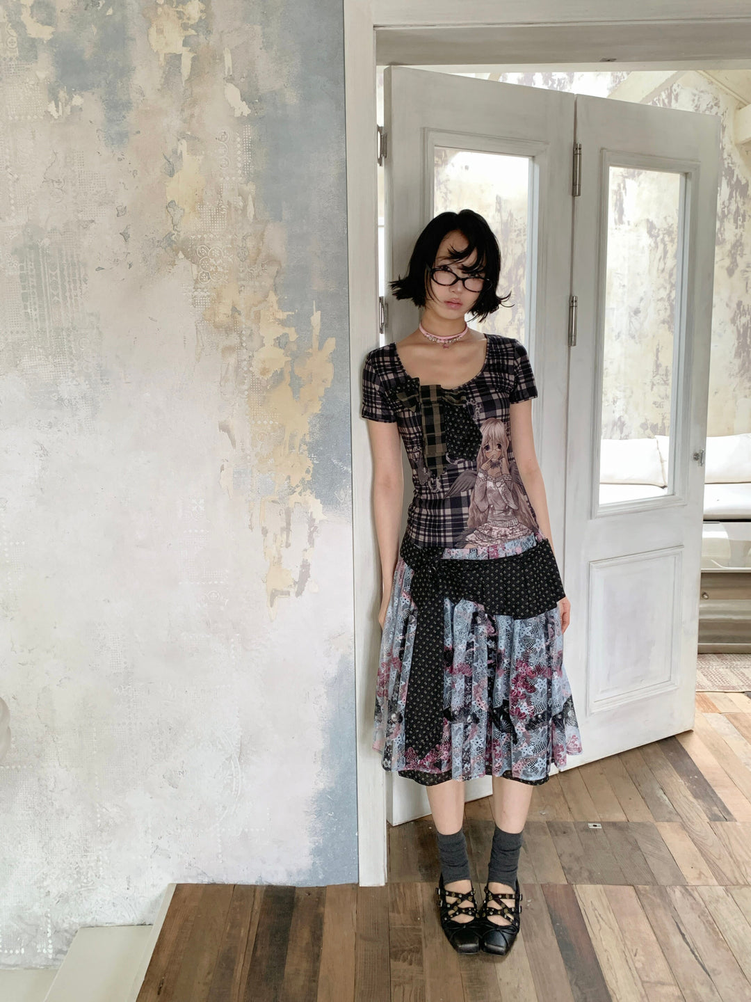 4RE1GN CROSS RIBBON jacquard lace layered skirt in multicolor — full-length modeled view in an open doorway