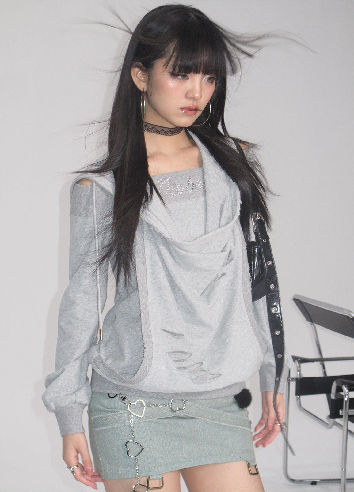 Alternate studio view of the gray layered hoodie