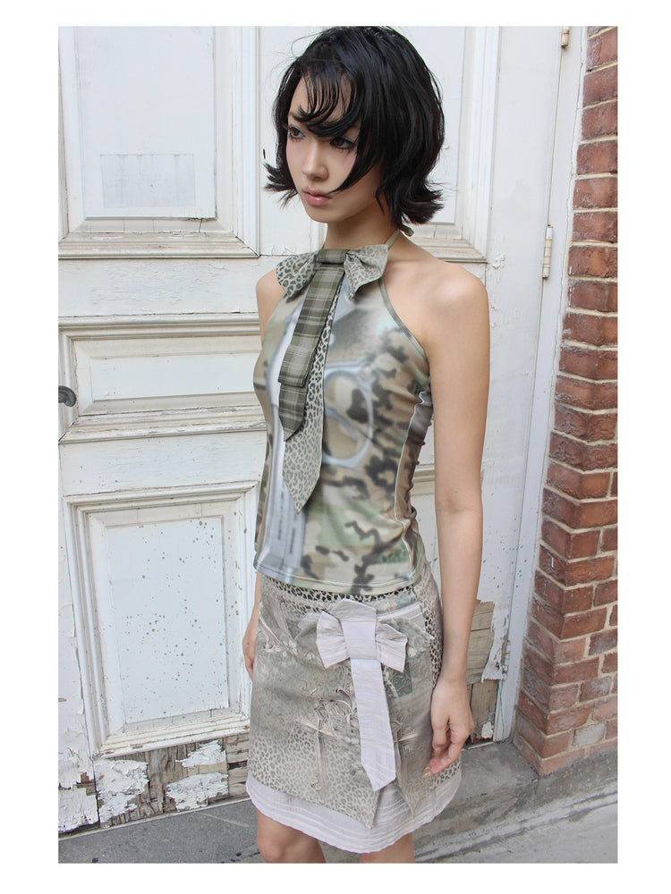 4RE1GN CROSS LEOPARD bow-detail layered skirt in beige multicolor — close three-quarter modeled view showing the bow