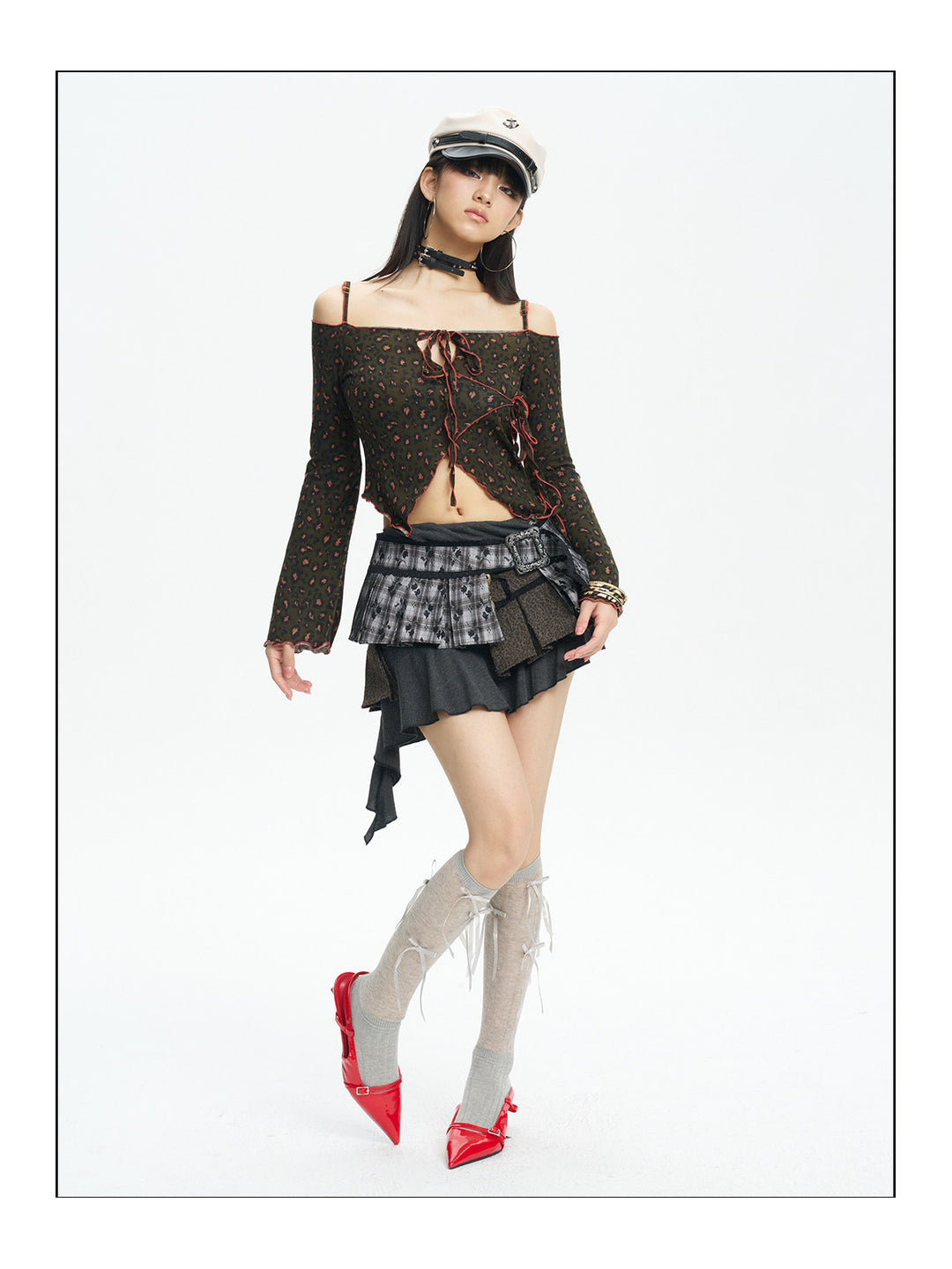 Full-length side view of the leopard off-shoulder knit top