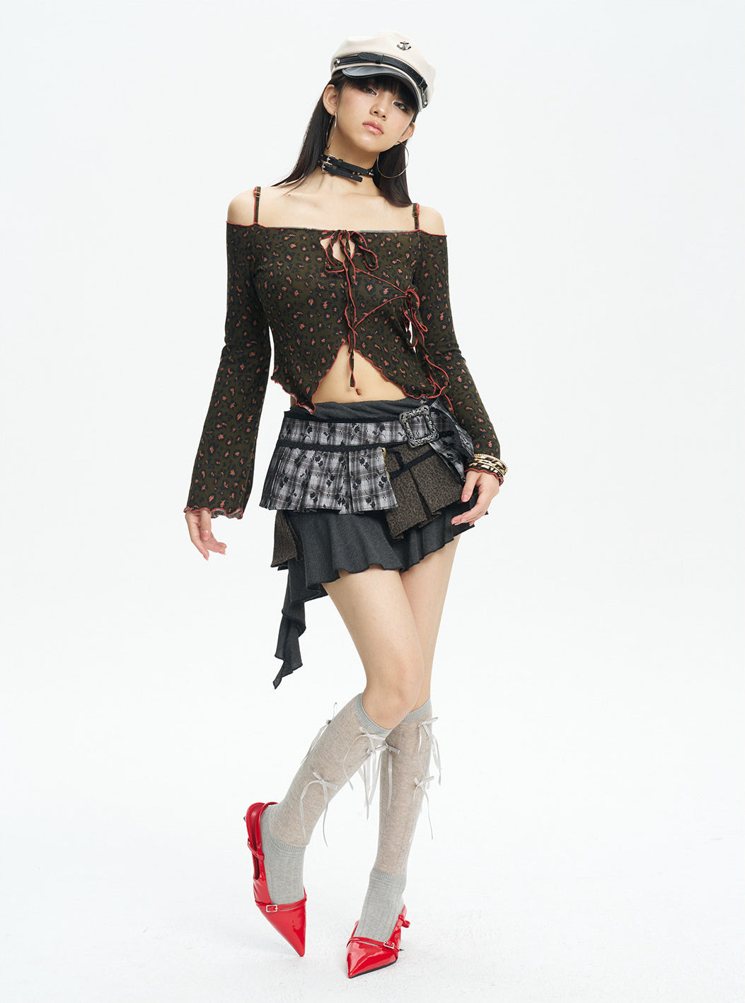 Full-length side view of the leopard off-shoulder knit top