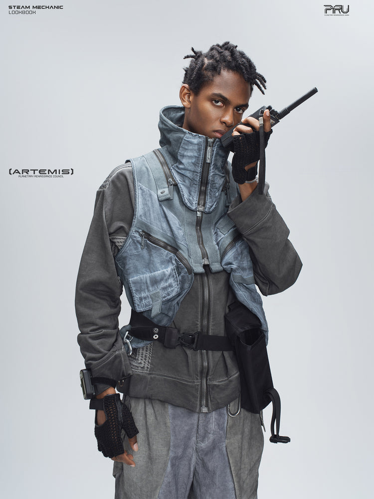 FISSION modular vest in star blue, front editorial view with a handheld radio