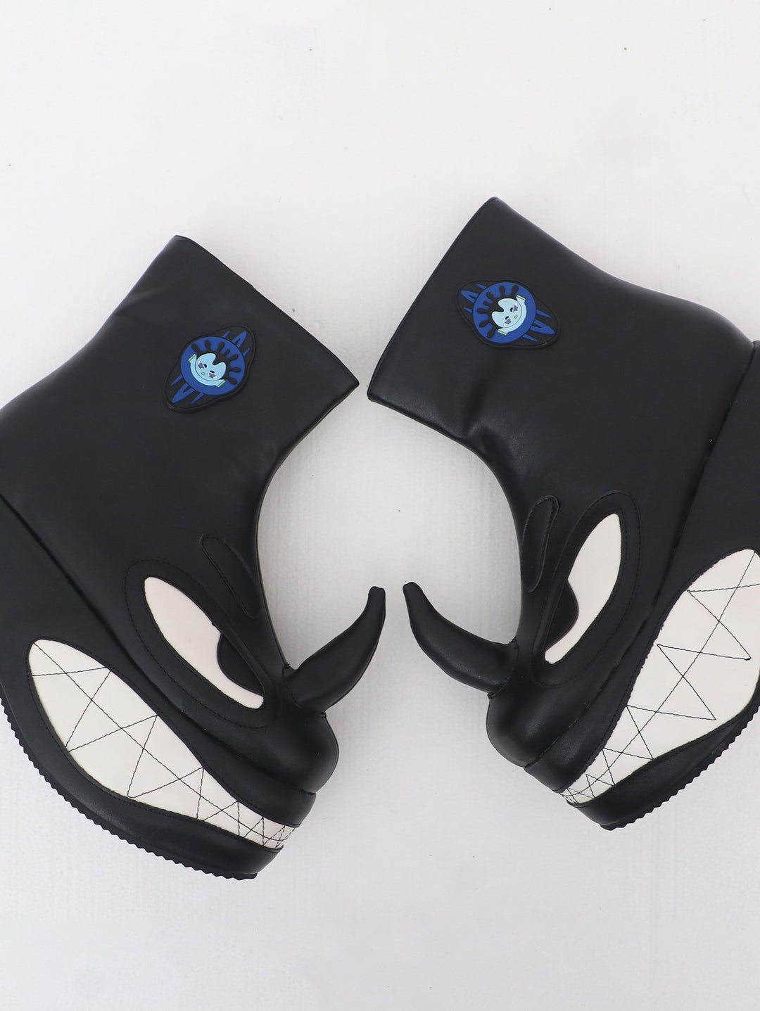 EMBRYO ANGRY horn-toe platform boots — top-down outer view
