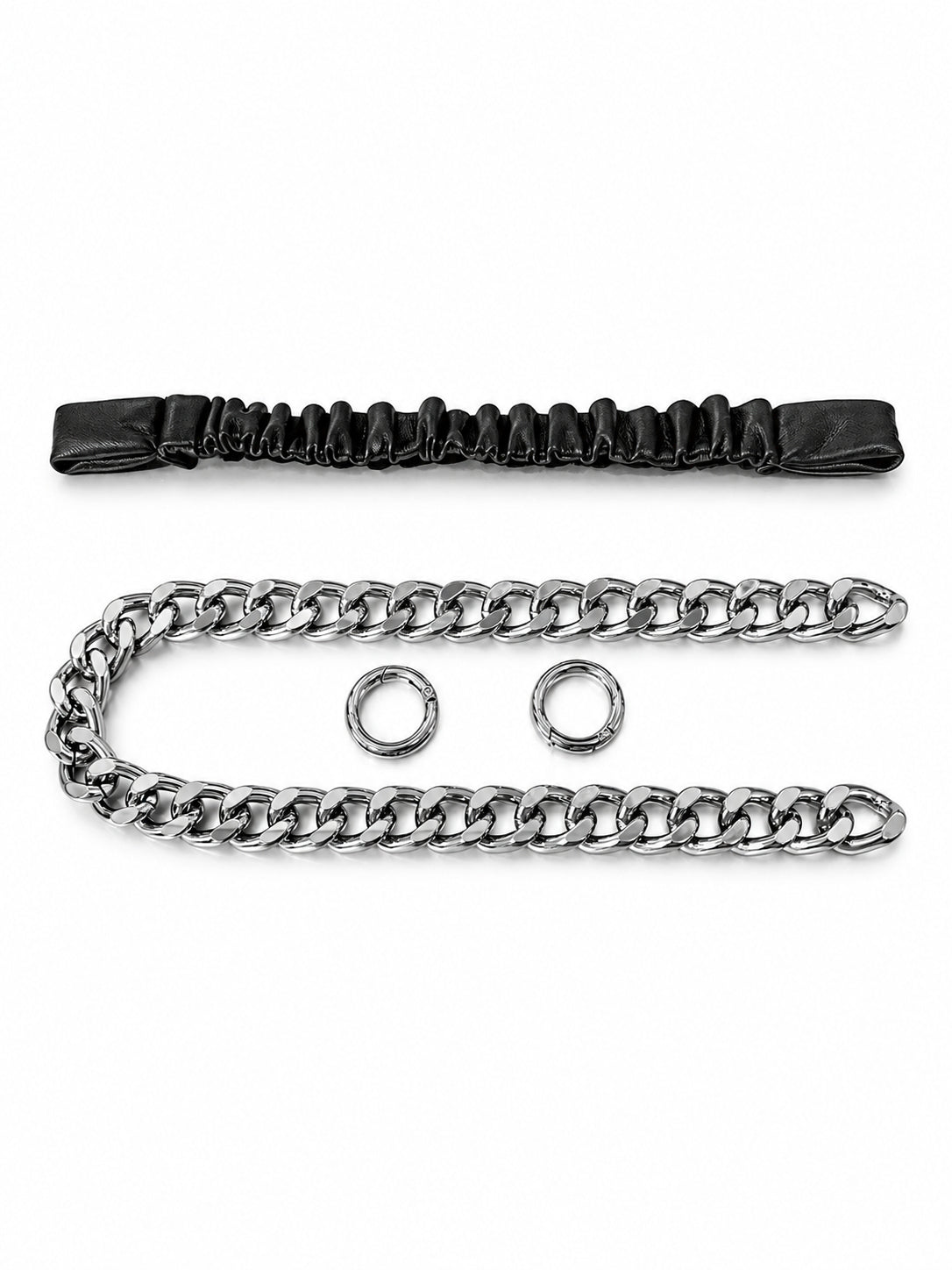 WRAVEN black gathered strap, detachable silver-tone curb chain and two round connectors on white.