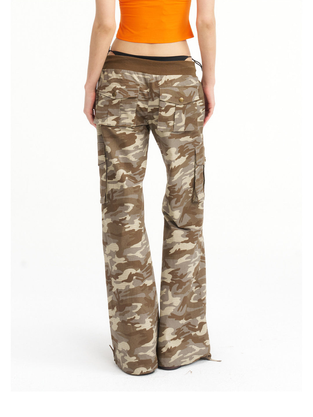 NEXT PASSPORT camouflage ribbed-waist flared pants — waist-down rear detail showing the ribbed waistband and back pockets.