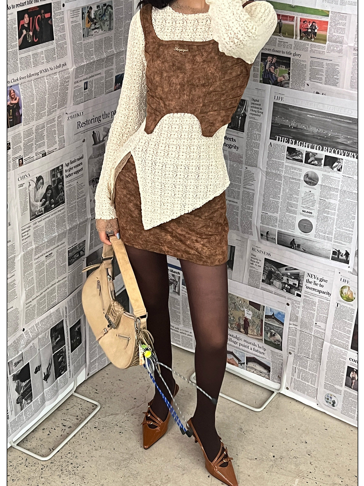 NEXT PASSPORT wasteland-brown shark-pleat vest and mini skirt — vest silhouette detail