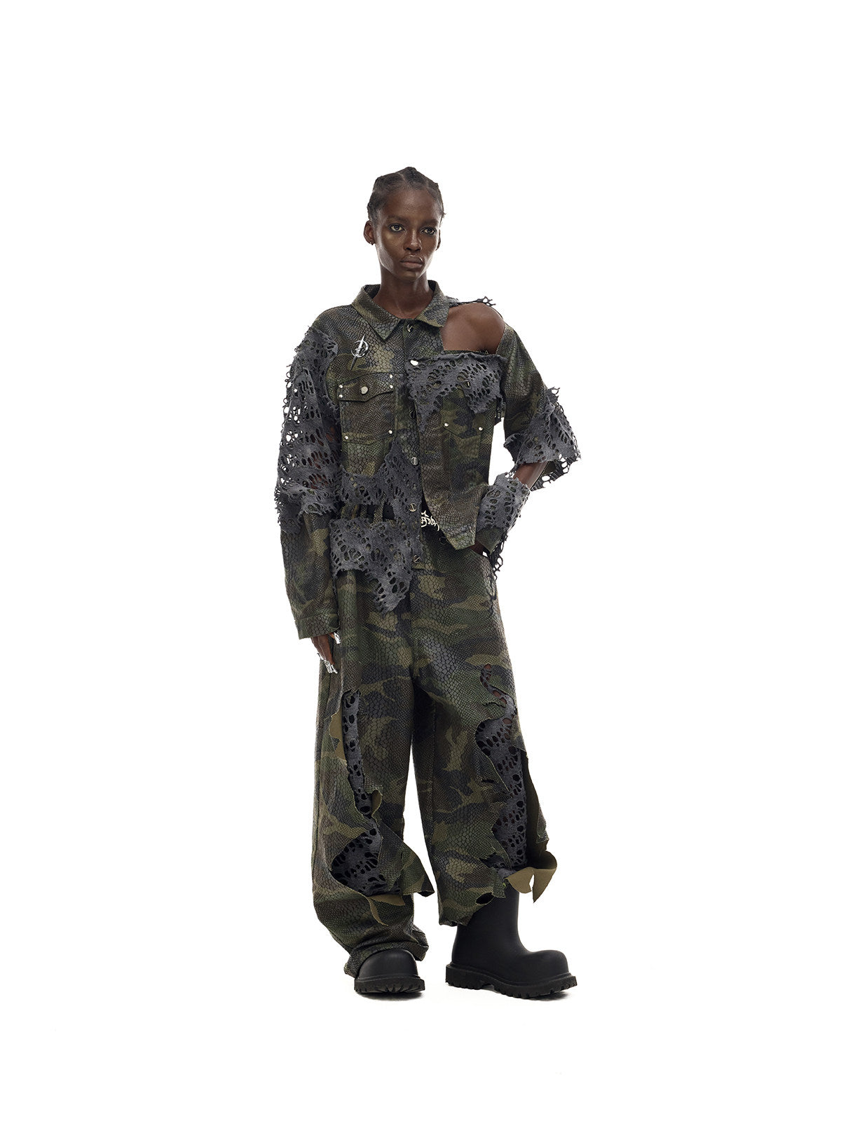 PINKSPINK DOUBLE STACK distressed camouflage wide-leg jeans — full-length angled modeled view with the matching camouflage jacket