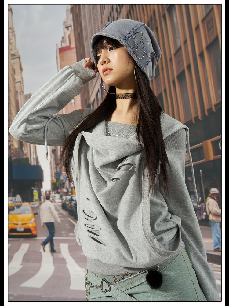 Outdoor modeled view of the gray distressed hoodie