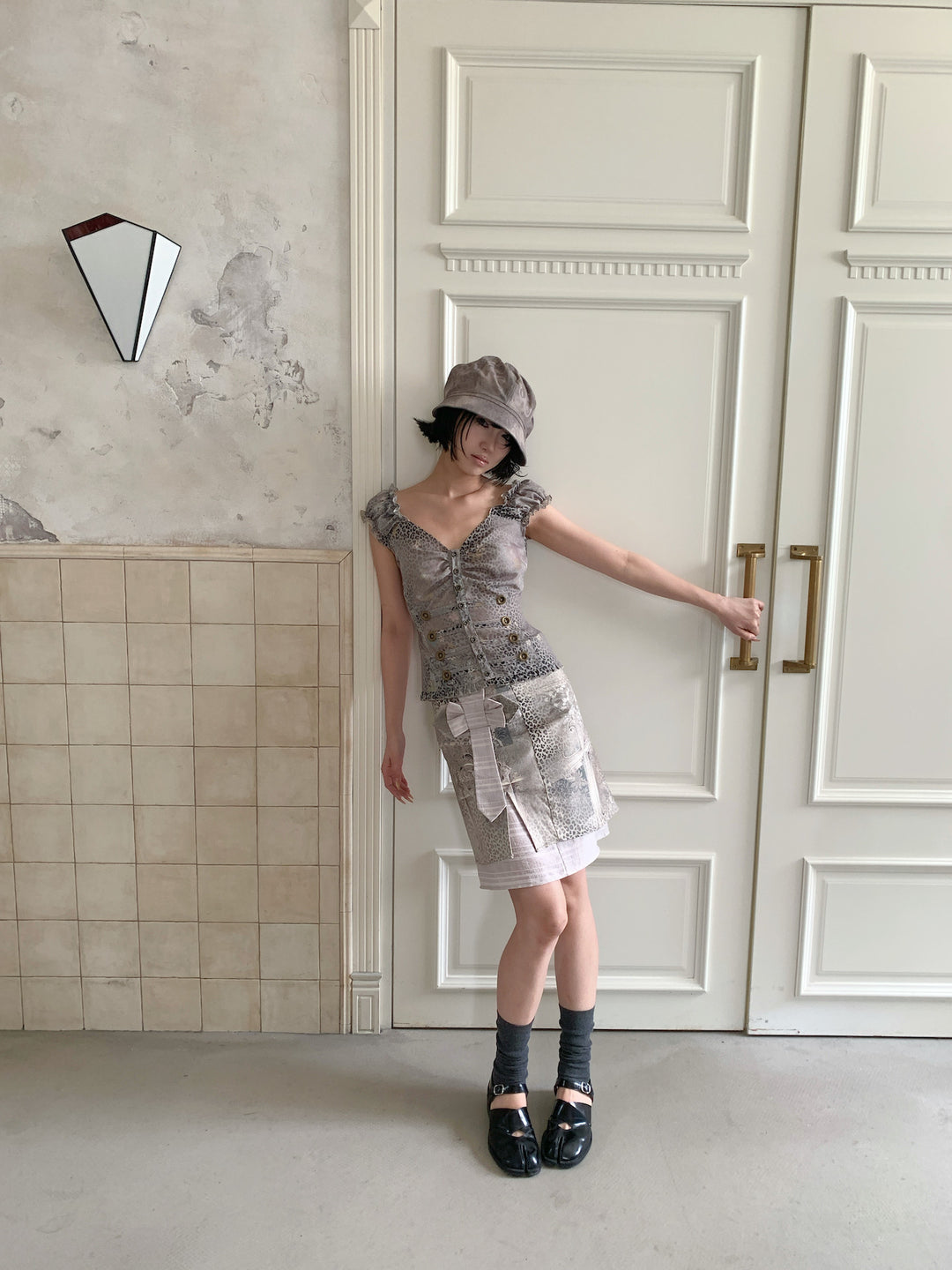 4RE1GN CROSS LEOPARD bow-detail layered skirt in beige multicolor — full-length modeled view styled with a ruffled vest and hat