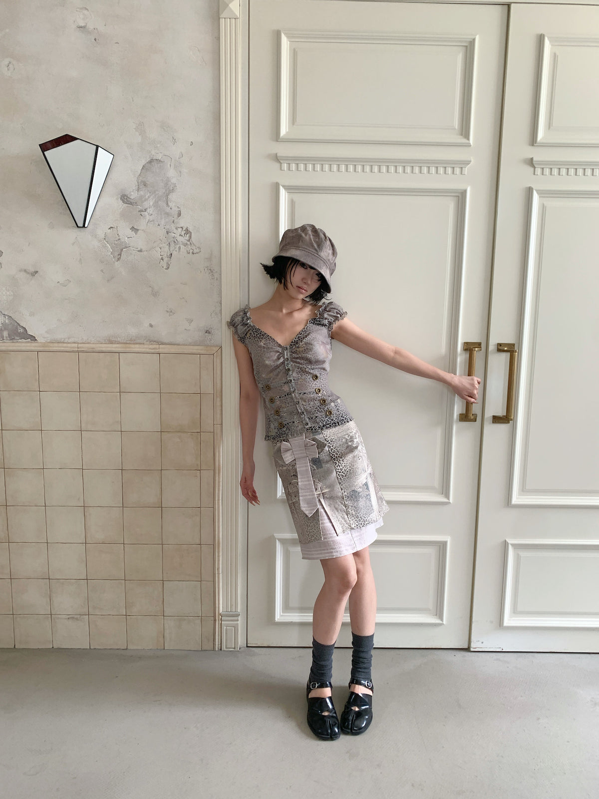4RE1GN CROSS LEOPARD bow-detail layered skirt in beige multicolor — full-length modeled view styled with a ruffled vest and hat