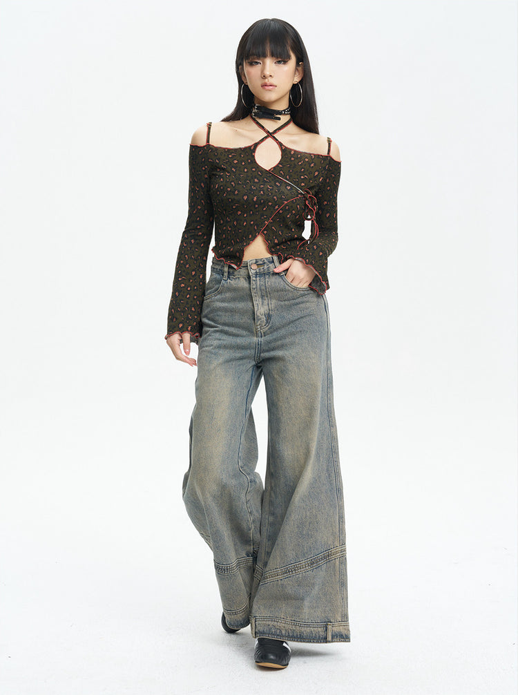 Full-length view of the leopard knit top styled with wide-leg jeans