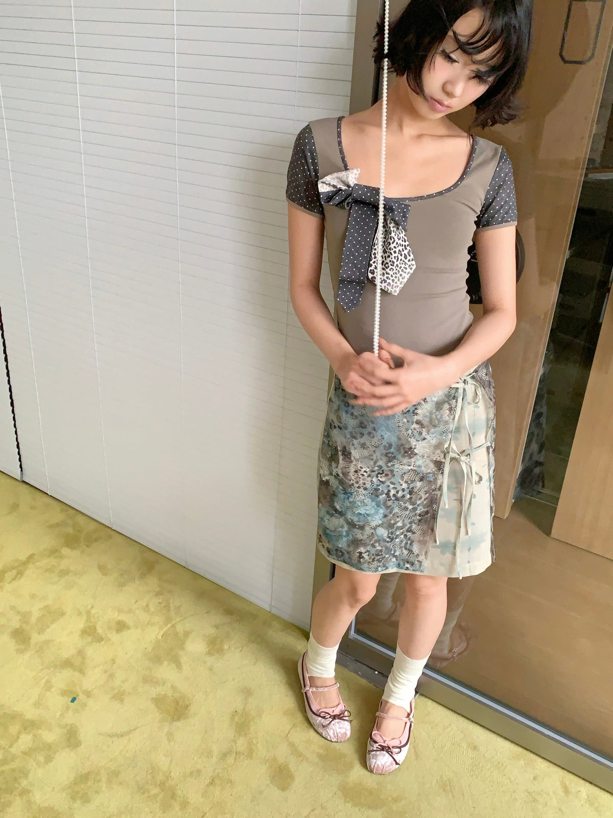 4RE1GN BLUE BLOOM tie-front layered skirt in blue multicolor — high-angle modeled view showing the lace panel and front ties