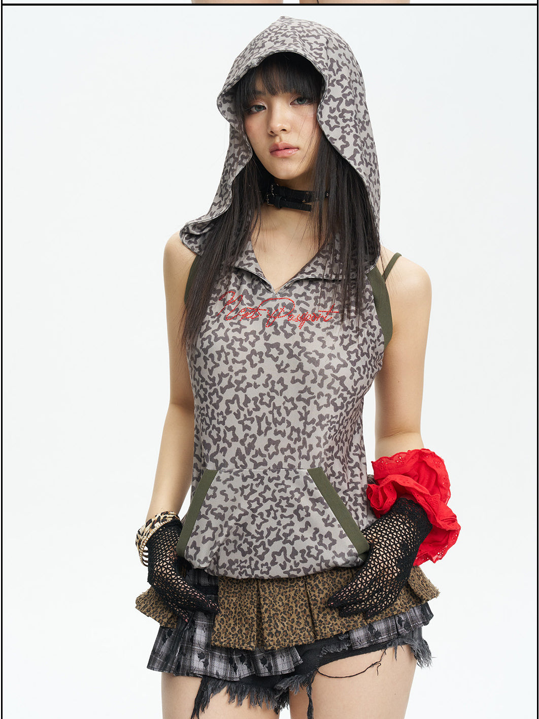 Front detail view of the leopard-print hooded vest