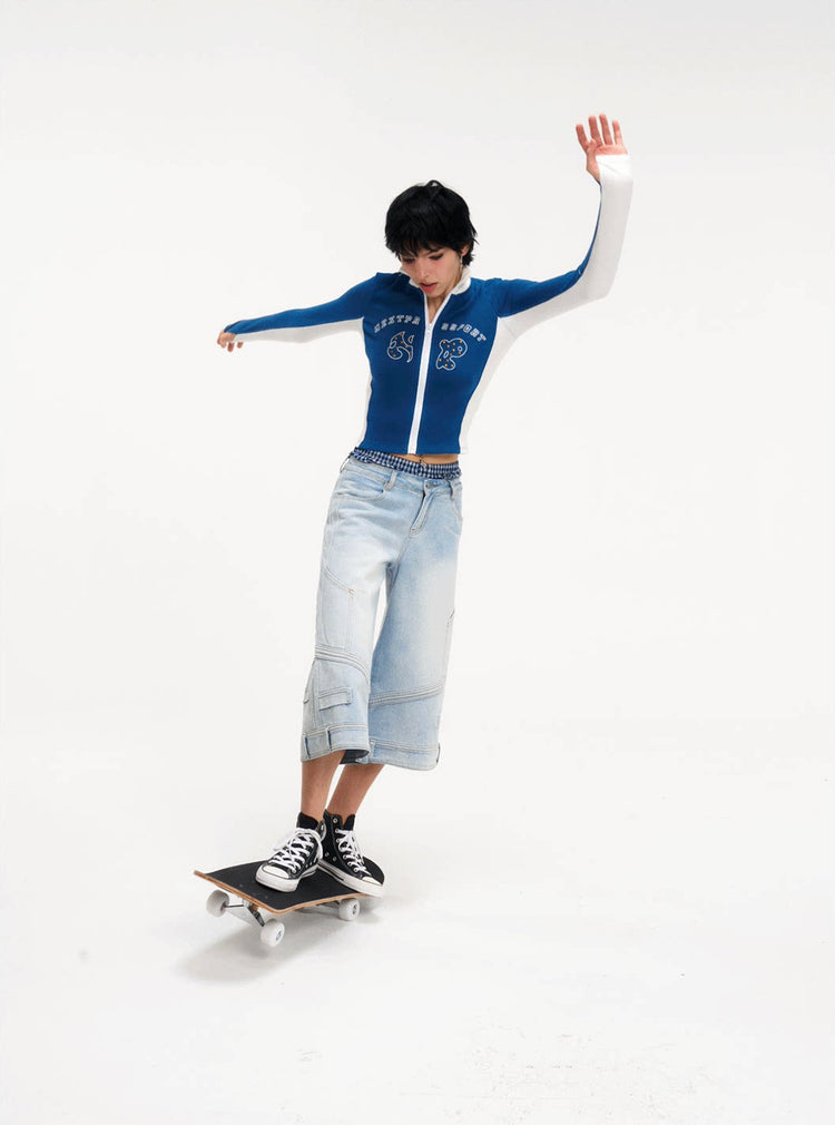 Modeled skateboard view of the light-blue cropped jeans