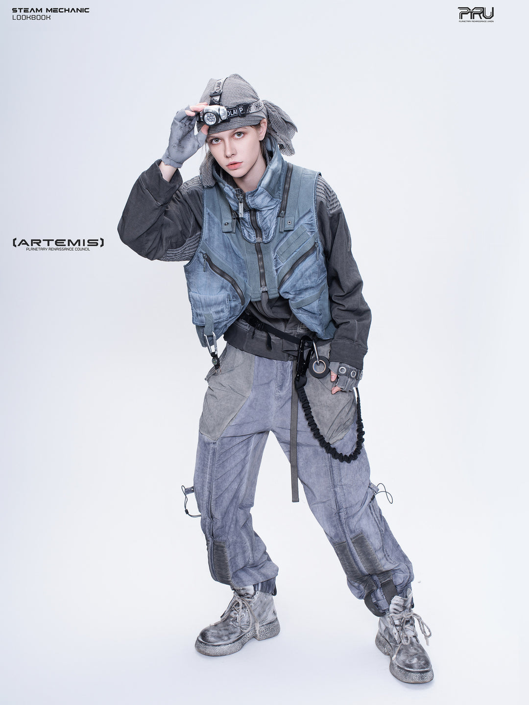 FISSION modular vest in star blue, female model leaning forward to show the front pockets
