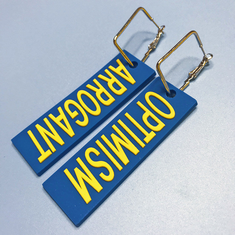 EOH-STUDIO BTBM blue ARROGANT and OPTIMISM earring examples showing rectangular metal attachment hardware.