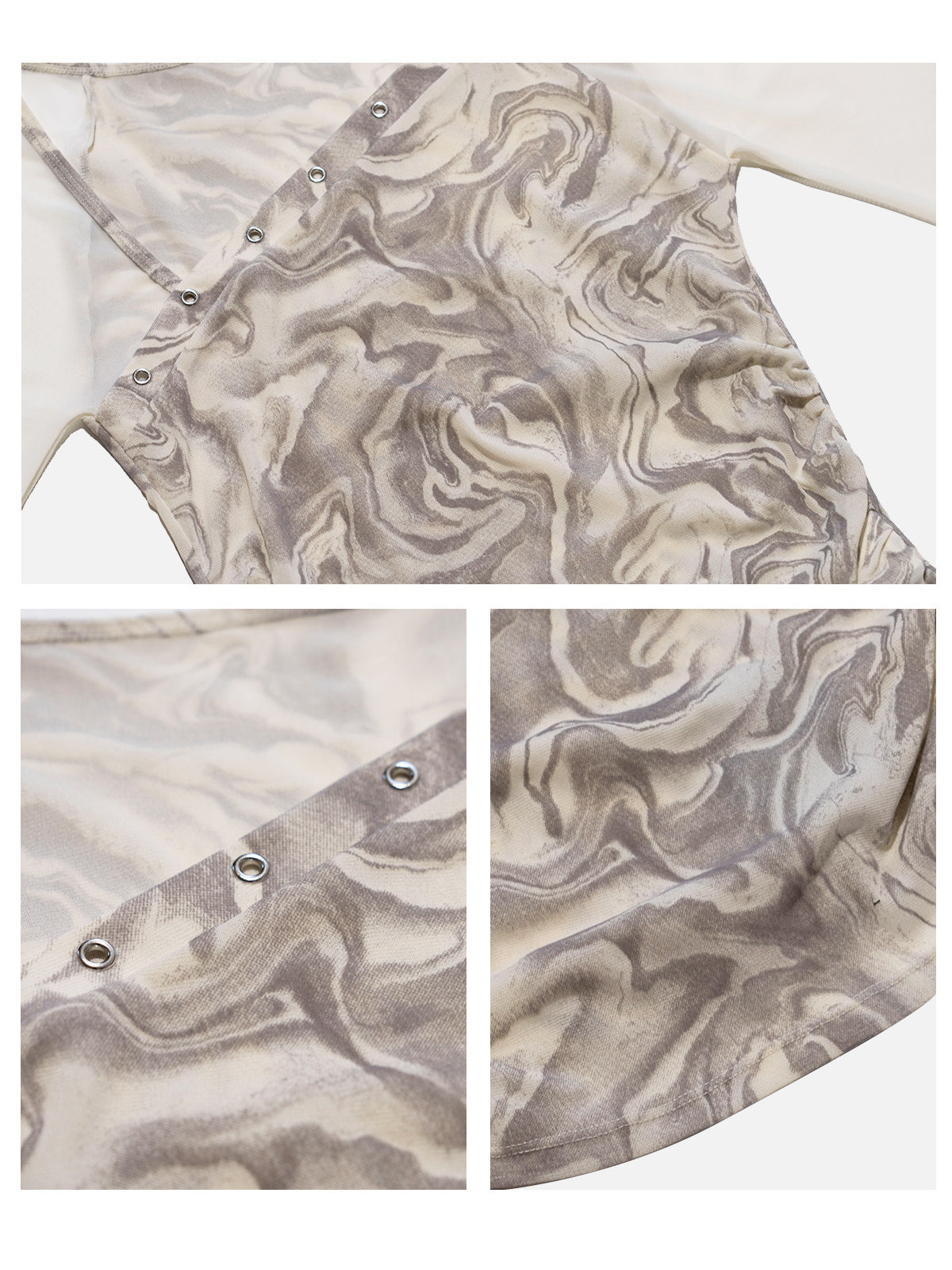 Close-up of the mesh fabric, silver-tone eyelets and marble print on the NEXT PASSPORT top.
