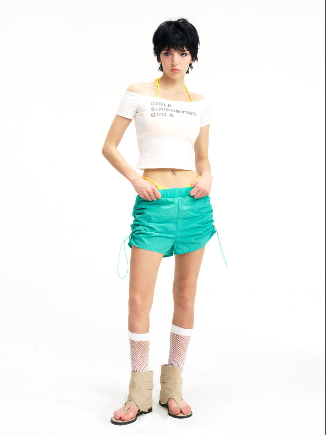 NEXT PASSPORT side-ruched drawstring mini shorts in green, front pose