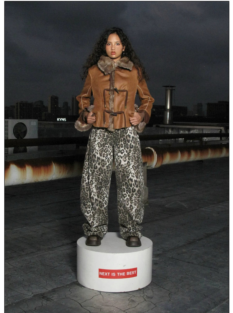 NEXT PASSPORT dark-brown rope-toggle shearling cropped jacket, nighttime rooftop full-length platform pose