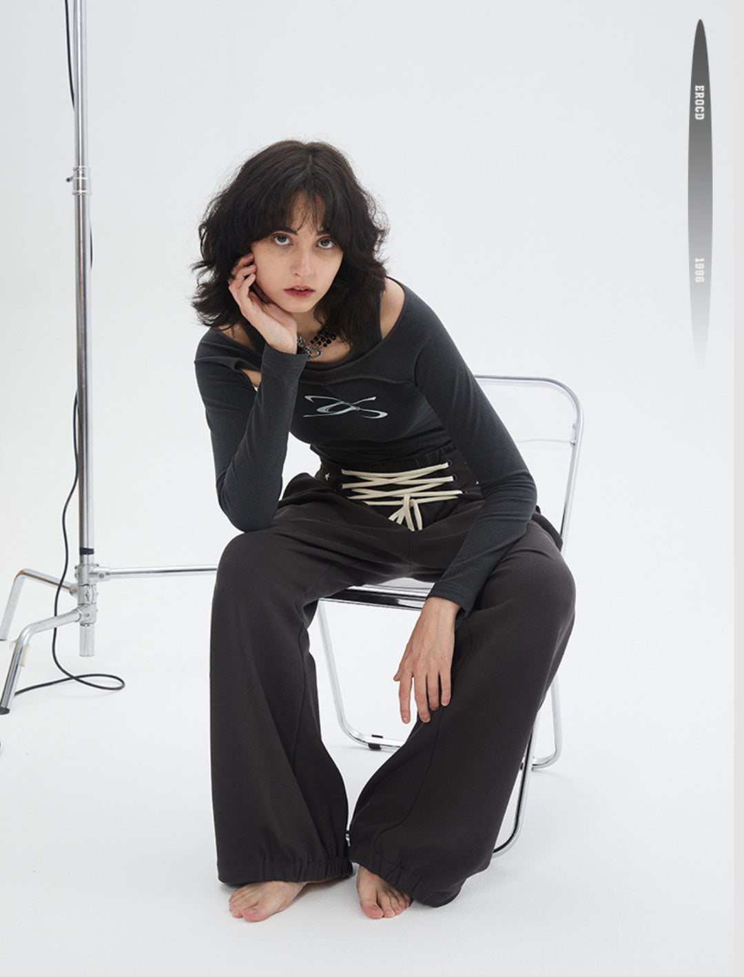 ERRORCODE ROBOT dark gray off-shoulder long-sleeve tee, seated front view with shoulder cutouts and chest logo