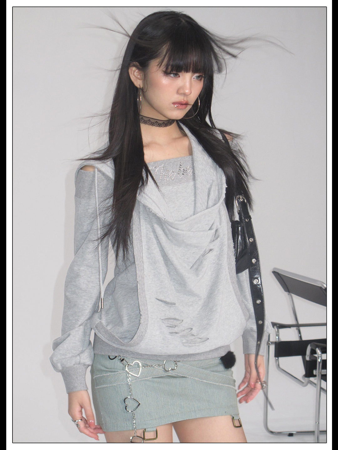 Alternate studio view of the gray layered hoodie