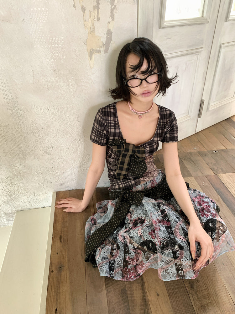 4RE1GN CROSS RIBBON jacquard lace layered skirt in multicolor — seated front modeled view