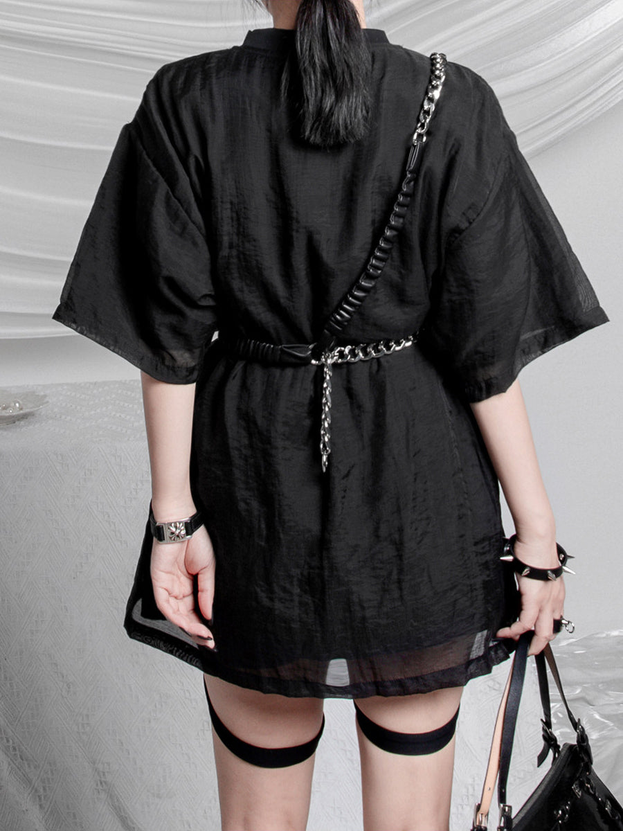 WRAVEN gathered faux-leather curb-chain belt — rear close-up of waist and crossbody styling; clothing not included.