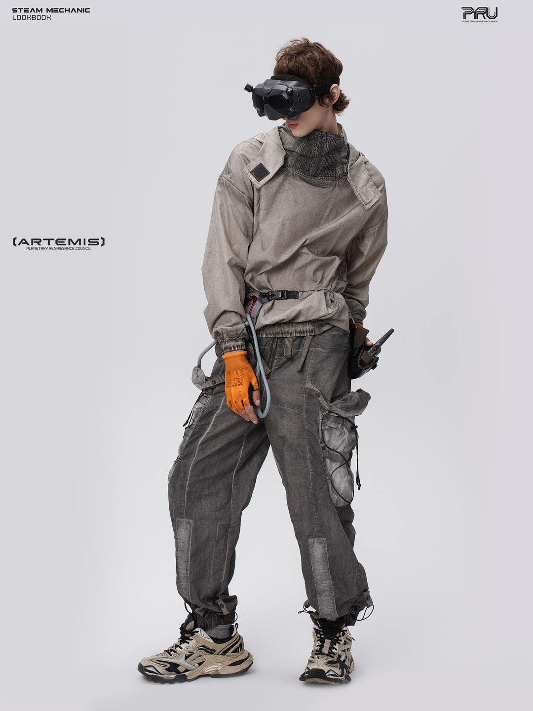 PIONEER meteorite-gray mesh hoodie, full-body leaning pose with goggles lowered