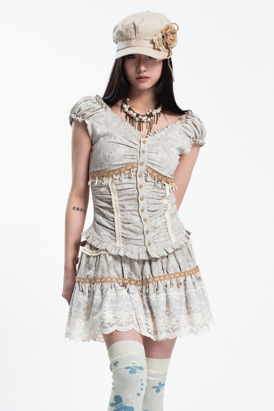 4RE1GN SHELL jacquard blouse and lace skirt separates in ivory — front studio modeled view with one leg bent