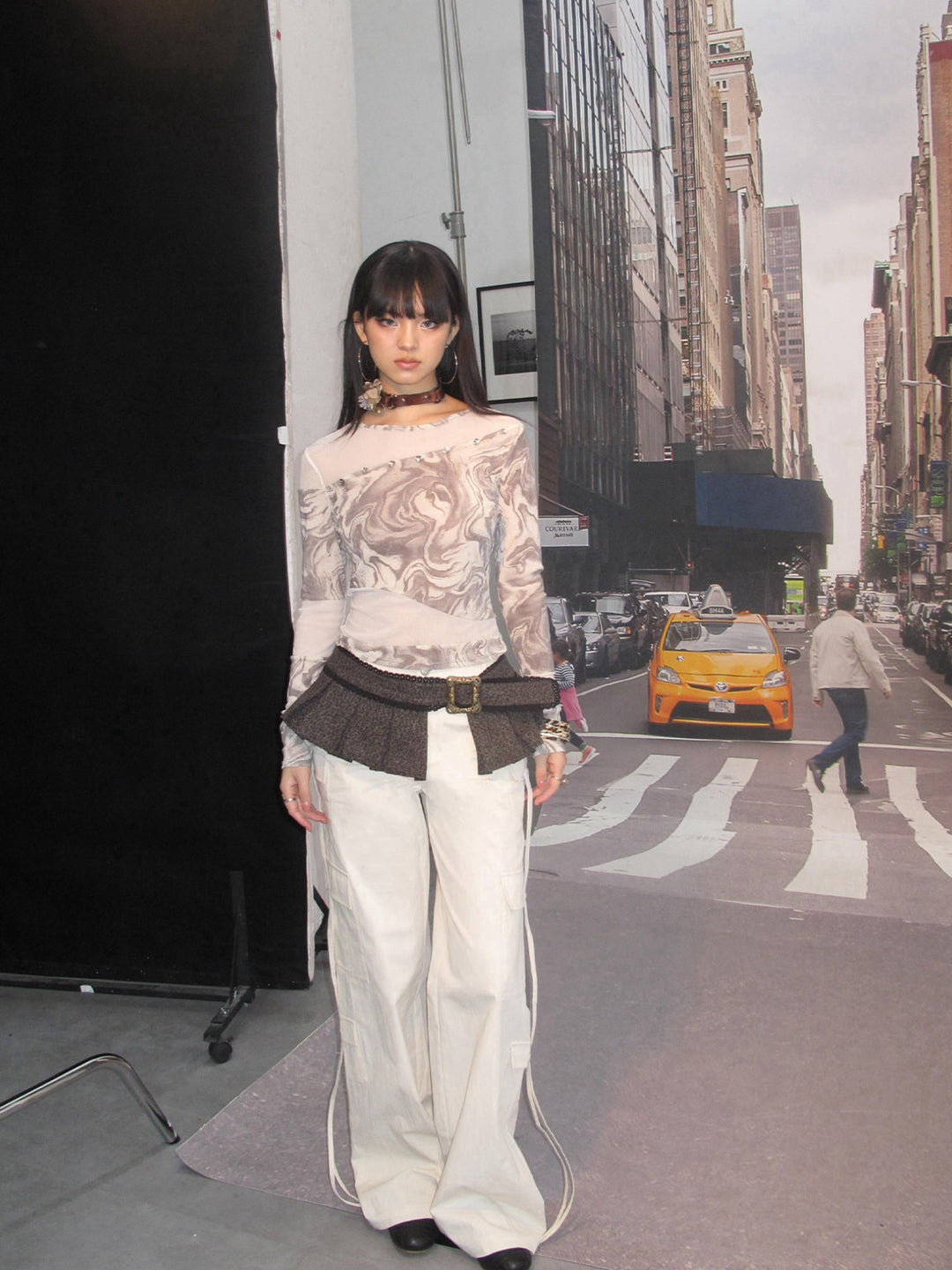 NEXT PASSPORT white drawstring multi-pocket cargo pants in white — full-length environmental model view.