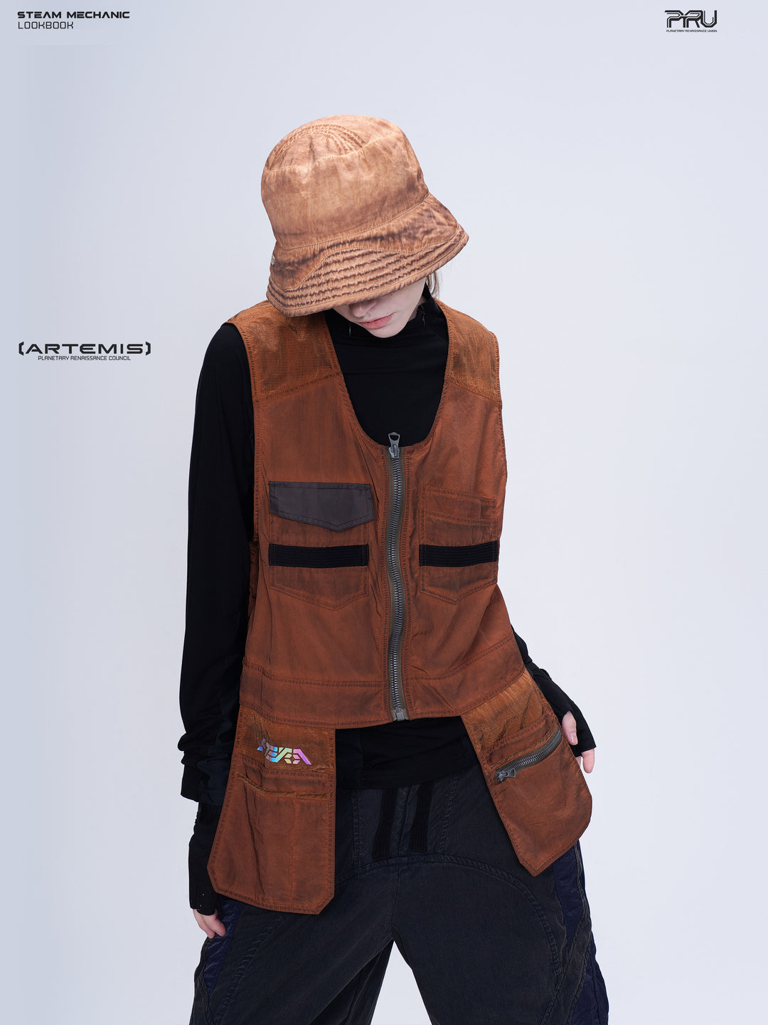 PIONEER sedna-red multi-pocket vest, front modeled pose with head lowered and hand at pocket