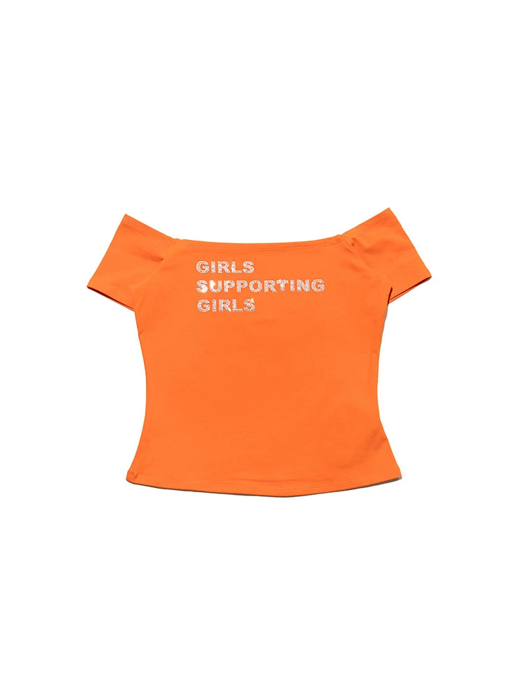 NEXT PASSPORT GIRLS SUPPORTING GIRLS rhinestone off-shoulder crop tee — orange garment-only front view.