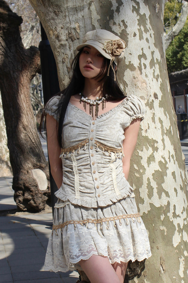 4RE1GN SHELL jacquard blouse and lace skirt separates in ivory — outdoor front modeled view leaning beside a tree