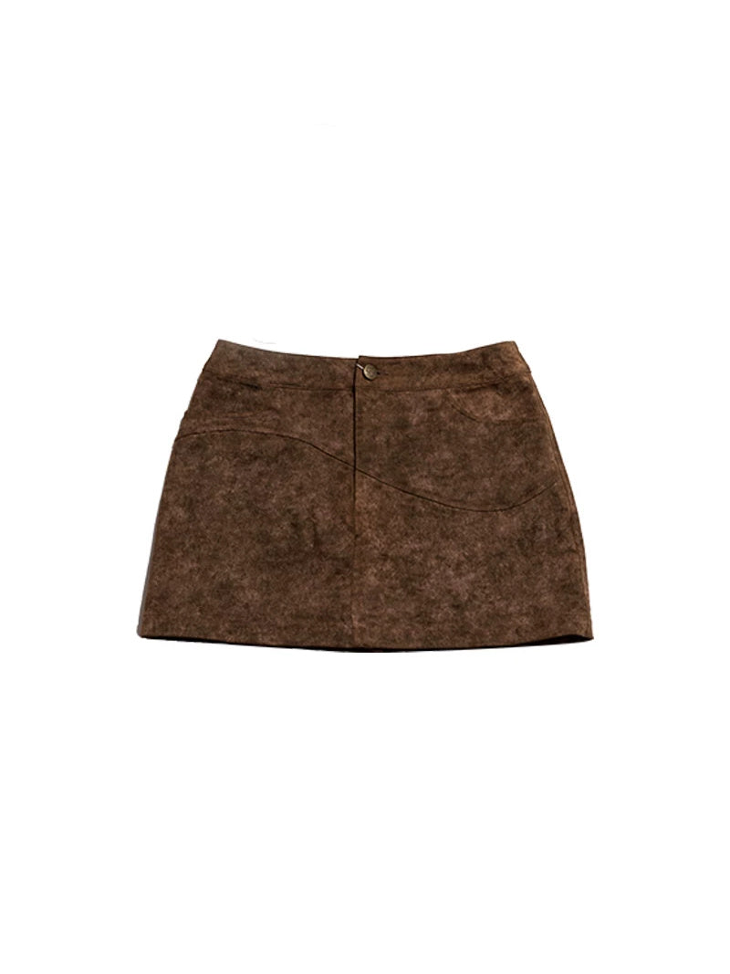 NEXT PASSPORT wasteland-brown shark-pleat mini skirt — clean garment-only view