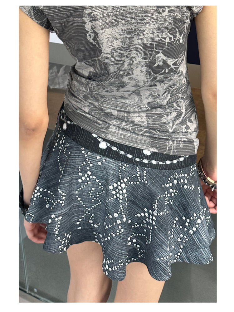 4RE1GN JEWEL denim-print lace mini skirt in black multicolor — close back modeled view showing the printed fabric