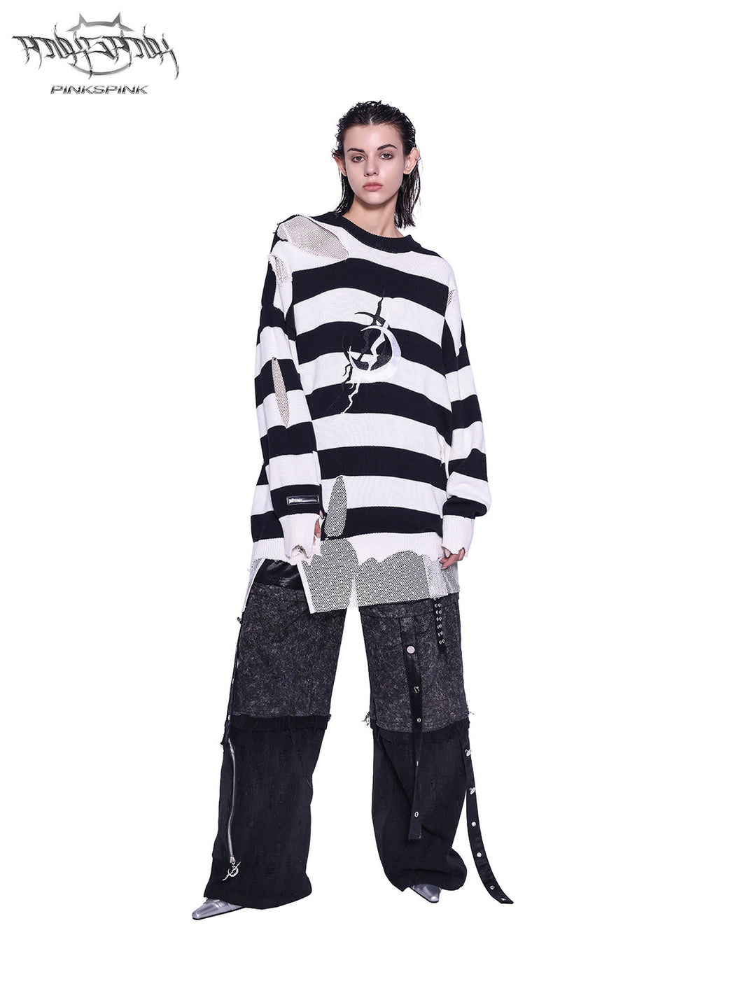 PINKSPINK ELECTRIC MOON distressed striped sweater in BLACK WHITE STRIPE — straight-on full-body view styled with dark cargo trousers.