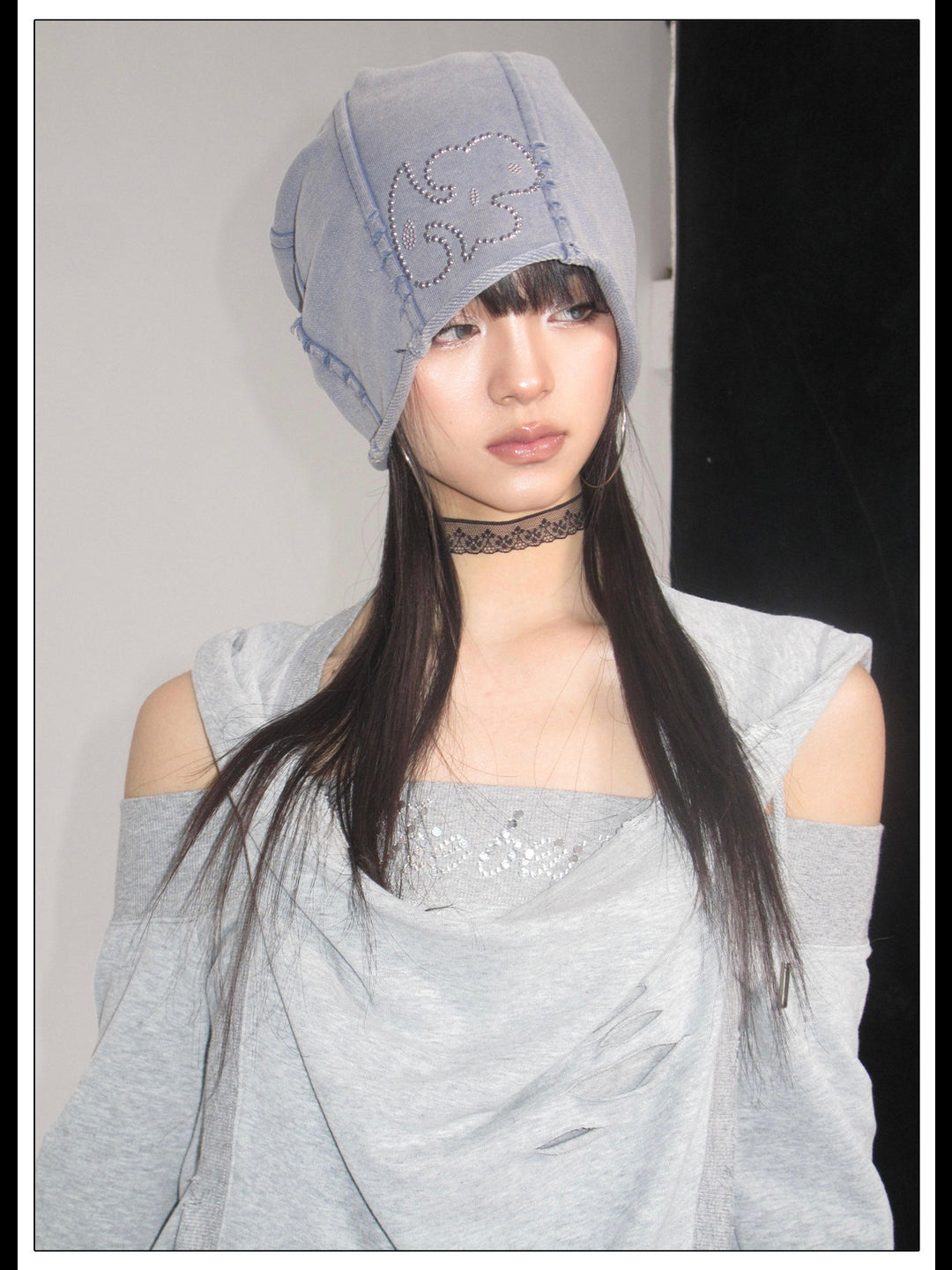 Front portrait showing the hood and rhinestone chest panel