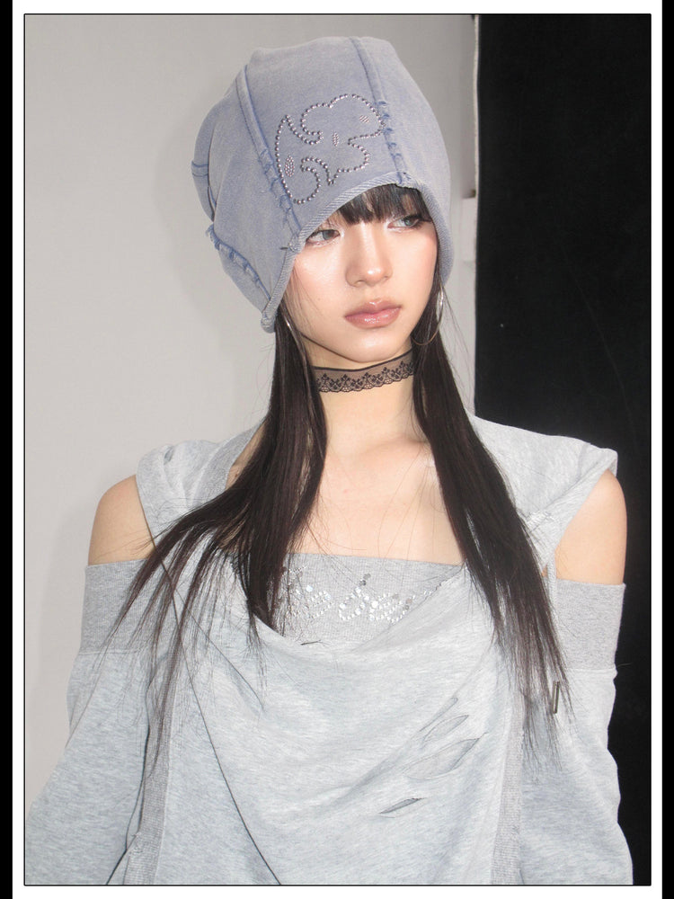 Front portrait showing the hood and rhinestone chest panel