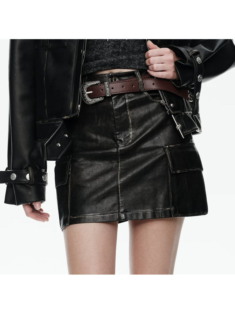 NEXT PASSPORT distressed cargo-pocket PU mini skirt, waist and pocket close-up