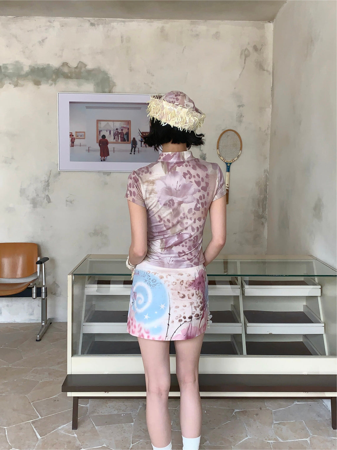 4RE1GN PINK REAPER lace-panel mandarin tee in pink multicolor — back modeled view showing floral and leopard artwork