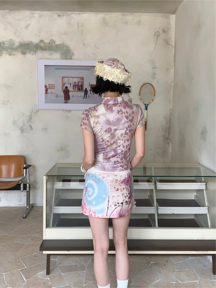4RE1GN PINK REAPER lace-panel mandarin tee in pink multicolor — back modeled view showing floral and leopard artwork