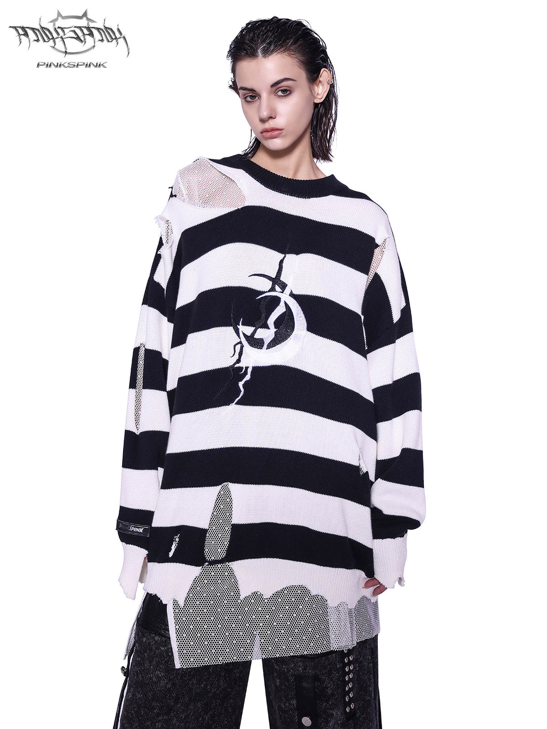 PINKSPINK ELECTRIC MOON distressed striped sweater in BLACK WHITE STRIPE — front three-quarter view showing the striped knit and asymmetric distressing.