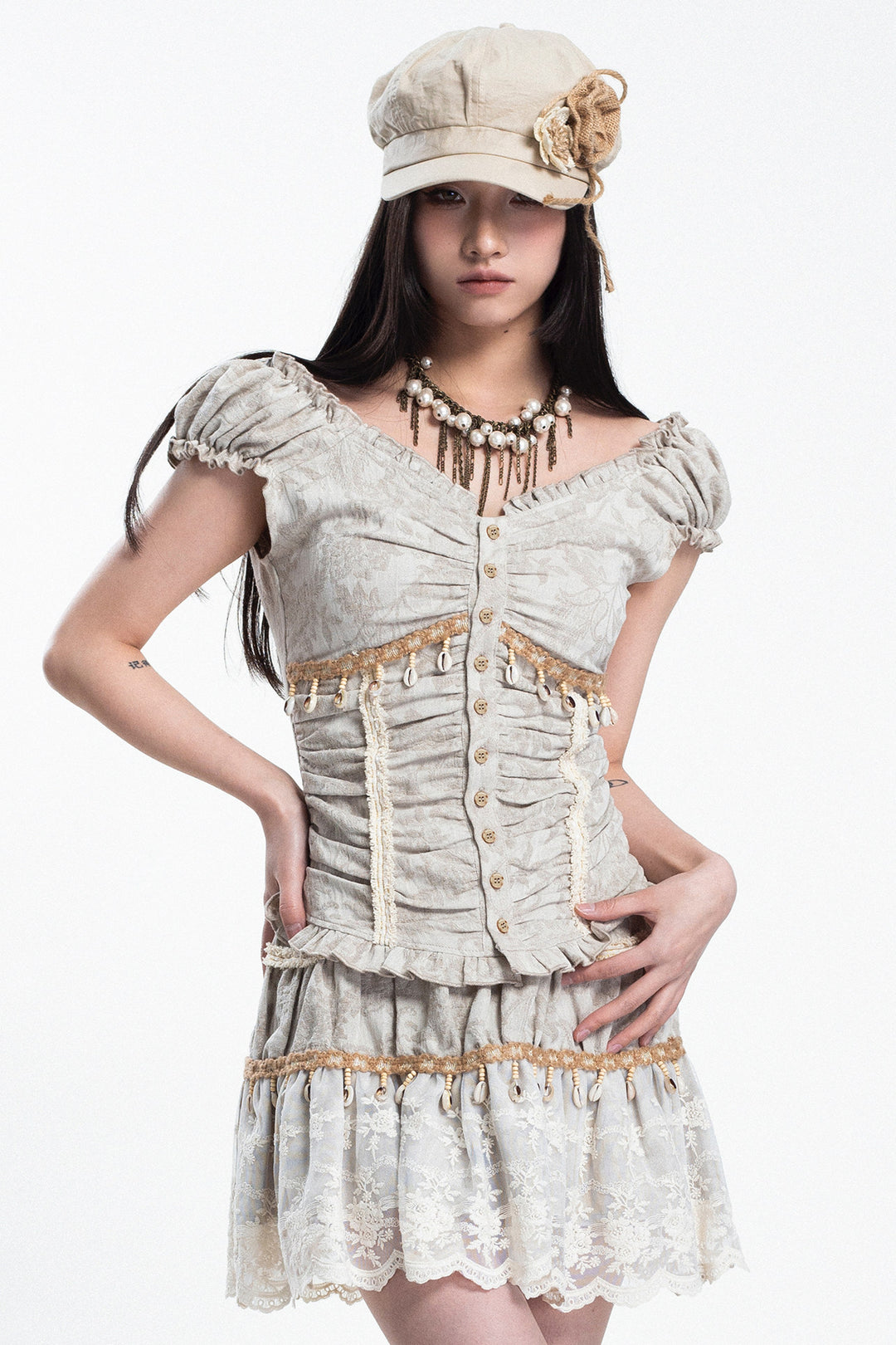 4RE1GN SHELL jacquard blouse and lace skirt separates in ivory — three-quarter studio modeled view with hands at the waist