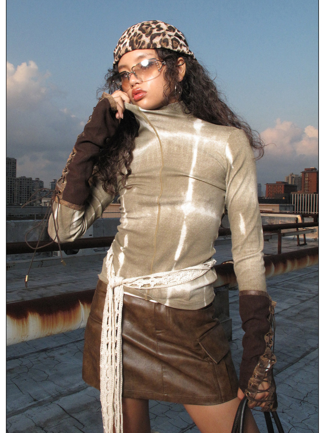 NEXT PASSPORT brown fitted mock-neck long-sleeve tee rooftop styling view.